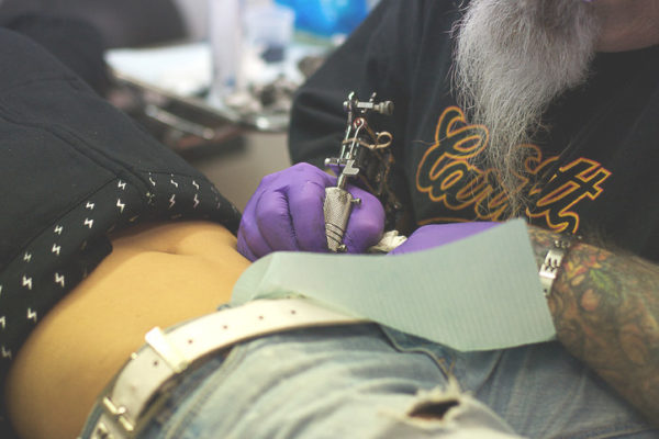 woman getting a tattoo