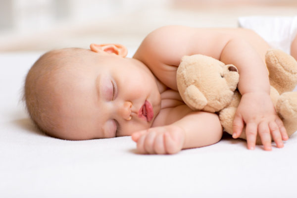 when do babies sleep through the night